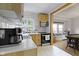 Charming kitchen with light wood cabinets, stainless steel appliances, and a farmhouse sink at 5715 Oak Ave, Indianapolis, IN 46219
