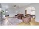 Comfortable living room with leather seating and an open archway to the dining area at 5715 Oak Ave, Indianapolis, IN 46219