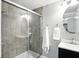 Tiled shower enclosure in this updated bathroom with modern fixtures at 6495 Titania Dr, Indianapolis, IN 46236
