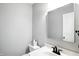 Neutral-toned half-bathroom with vanity, mirror, and toilet at 6495 Titania Dr, Indianapolis, IN 46236