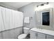 Bathroom featuring a shower with curtain, modern sink, and framed mirror at 6495 Titania Dr, Indianapolis, IN 46236