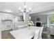 Bright dining area adjacent to the kitchen and living room, perfect for entertaining at 6495 Titania Dr, Indianapolis, IN 46236