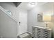 Entryway view showing the front door, console table, and staircase at 6495 Titania Dr, Indianapolis, IN 46236