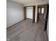 Neutral bedroom with carpeting, closet, neutral walls, and doorway to hallway at 6611 Wandering Way, Indianapolis, IN 46241