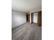 Neutral bedroom with carpeting, closet, neutral walls, and doorway to hallway at 6611 Wandering Way, Indianapolis, IN 46241