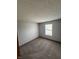 Bedroom featuring neutral paint, carpet and a window providing natural light at 6611 Wandering Way, Indianapolis, IN 46241