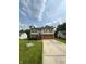 Inviting two-story home with a lush green lawn and driveway, providing a welcoming curb appeal at 6611 Wandering Way, Indianapolis, IN 46241