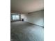 This spacious living room has neutral paint, carpet, and a fireplace at 6611 Wandering Way, Indianapolis, IN 46241
