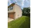 A spacious, well-manicured lawn surrounds this charming home, providing a serene and inviting outdoor space at 6611 Wandering Way, Indianapolis, IN 46241