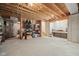 Spacious unfinished basement featuring exposed wood beams, concrete floor, and block foundation at 6733 Jons, Zionsville, IN 46077