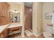 Bathroom features a vanity with make up table and tiled walk in shower at 6733 Jons, Zionsville, IN 46077