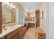 Spacious primary bathroom with dual sink vanity, walk-in shower, and white plantation shutters at 6733 Jons, Zionsville, IN 46077
