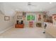 Bonus room with neutral tones, natural light, vintage décor, and ceiling fan offers a unique and versatile space at 6733 Jons, Zionsville, IN 46077