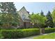 Charming two-story brick home with lush landscaping, mature trees, well-maintained lawn, and a cozy curb appeal at 6733 Jons, Zionsville, IN 46077