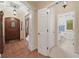 Welcoming foyer with tile flooring, decorative archway, and view to the bathroom and secondary living space at 6733 Jons, Zionsville, IN 46077