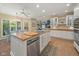 The eat-in kitchen features custom cabinetry, stainless appliances, and tile floors at 6733 Jons, Zionsville, IN 46077