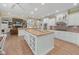 Large eat-in kitchen features custom cabinetry, tile floors, and modern appliances at 6733 Jons, Zionsville, IN 46077