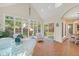 Bright sunroom with tile floors and large windows offering abundant natural light at 6733 Jons, Zionsville, IN 46077