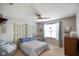 Charming bedroom features natural light and decorative plants to bring the outdoors in at 6848 Harriet Dr, Indianapolis, IN 46237