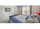 Well lit bedroom featuring a neutral wall color and carpeted floors at 6848 Harriet Dr, Indianapolis, IN 46237