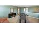Open bonus room featuring a foosball table and comfortable seating area at 6848 Harriet Dr, Indianapolis, IN 46237