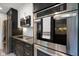 Close up of the stainless steel stove in the kitchen, as well as microwave and refrigerator at 6848 Harriet Dr, Indianapolis, IN 46237