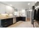 Modern kitchen with stainless steel appliances, black countertops and white cabinets at 6848 Harriet Dr, Indianapolis, IN 46237
