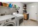 Laundry room with washer and dryer and extra storage space at 6848 Harriet Dr, Indianapolis, IN 46237