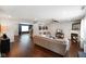 Bright living room featuring hardwood floors, a fireplace, and a comfortable sectional sofa at 6848 Harriet Dr, Indianapolis, IN 46237