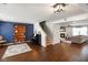 Open-concept living room featuring hardwood floors, a staircase, and natural light at 6848 Harriet Dr, Indianapolis, IN 46237