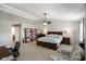 Spacious main bedroom featuring a ceiling fan and a large window for natural light at 6848 Harriet Dr, Indianapolis, IN 46237
