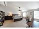 Bright main bedroom with vaulted ceilings, ceiling fan, and warm color palette at 6848 Harriet Dr, Indianapolis, IN 46237