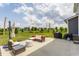 Backyard patio featuring modern outdoor furniture, and a string of lights at 6902 Diamondleaf Way, Brownsburg, IN 46112