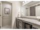 Bathroom with a granite countertop vanity, modern fixtures, and a mirror at 6902 Diamondleaf Way, Brownsburg, IN 46112