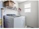 Laundry room equipped with a front load washer and dryer, overhead shelf for storage at 6902 Diamondleaf Way, Brownsburg, IN 46112