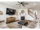 Inviting living room showcasing a fireplace, large TV, and comfortable seating arrangements at 6902 Diamondleaf Way, Brownsburg, IN 46112