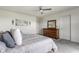 Comfortable bedroom with dresser, ceiling fan, and closet door at 6902 Diamondleaf Way, Brownsburg, IN 46112