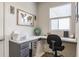 Cozy home office with a built-in desk, ample natural light, and neutral color scheme at 6902 Diamondleaf Way, Brownsburg, IN 46112