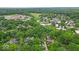 Aerial view of property and surrounding neighborhood showcasing green spaces and community layout at 7502 Colony Cir, Indianapolis, IN 46260