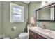 Updated bathroom featuring modern fixtures, natural light from window and tile flooring at 7502 Colony Cir, Indianapolis, IN 46260