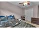 Comfortable bedroom featuring carpet, an updated closet, and a ceiling fan at 7502 Colony Cir, Indianapolis, IN 46260