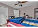 Bedroom with hardwood floors, natural light, and neutral color palette at 7502 Colony Cir, Indianapolis, IN 46260