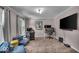 Game room with carpet floors, neutral paint, and a large TV at 7502 Colony Cir, Indianapolis, IN 46260