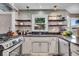 Charming kitchen with decorative backsplash, stainless steel appliances, and updated finishes at 7502 Colony Cir, Indianapolis, IN 46260