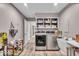 Well-organized laundry room with modern washer and dryer, ample storage, and a utility sink at 7502 Colony Cir, Indianapolis, IN 46260