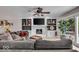 Comfortable living room with white fireplace, built in shelving, and large sliding glass doors at 7502 Colony Cir, Indianapolis, IN 46260