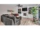 Living room with fireplace, built ins, hardwood floors, and sliding glass doors to the outdoors at 7502 Colony Cir, Indianapolis, IN 46260