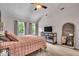 Airy main bedroom featuring lots of natural light, carpet flooring, and a large mirror at 7502 Colony Cir, Indianapolis, IN 46260
