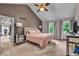 Spacious main bedroom with vaulted ceilings, two windows, lamps and carpet flooring at 7502 Colony Cir, Indianapolis, IN 46260