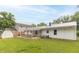 Spacious backyard view of the home, showing the back porch and exterior siding at 814 N Noble St, Greenfield, IN 46140